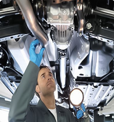 A mechanic checking a car