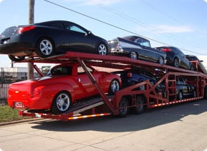 A truck carrying 7 cars