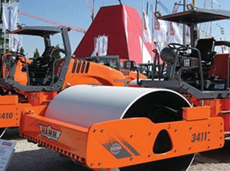 Road building machine at shipping dock